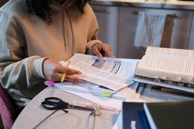 Person with books studying