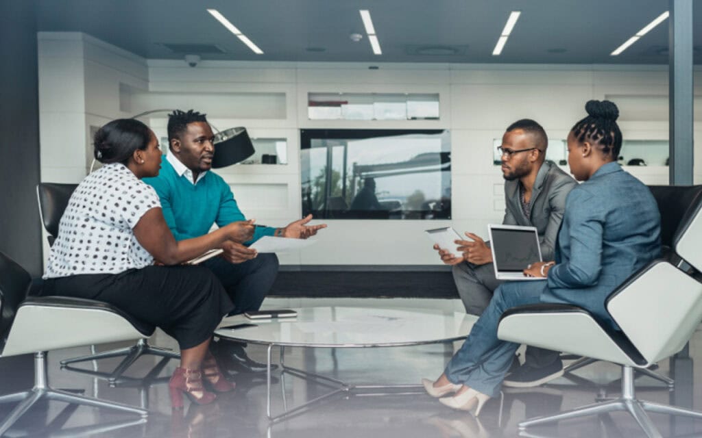 Diverse group of professionals having a meeting in modern office conference room.