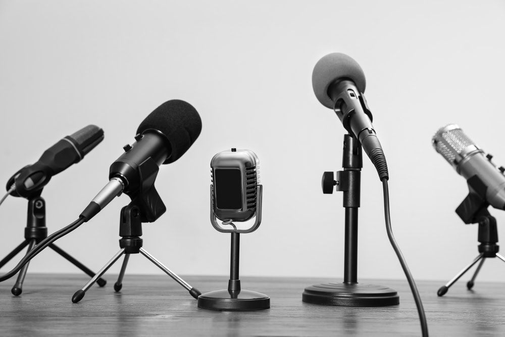 Microphones on stands for podcast or press conference speakings.