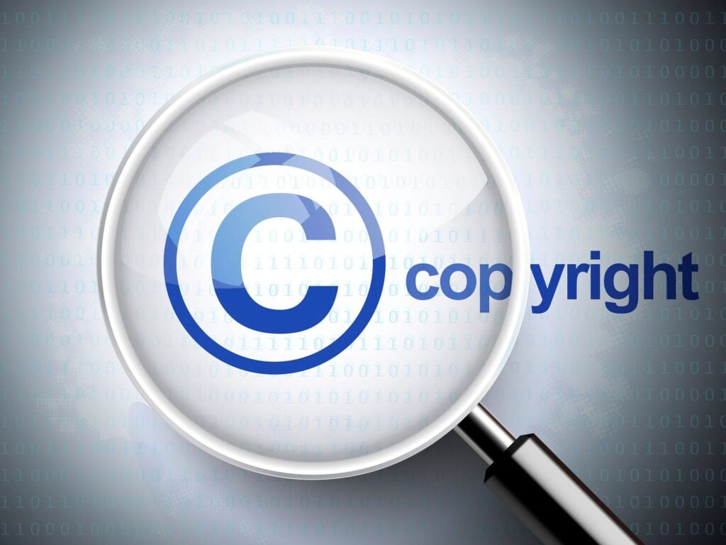 Copyright symbol with magnifying glass over binary code background, digital technology concept.