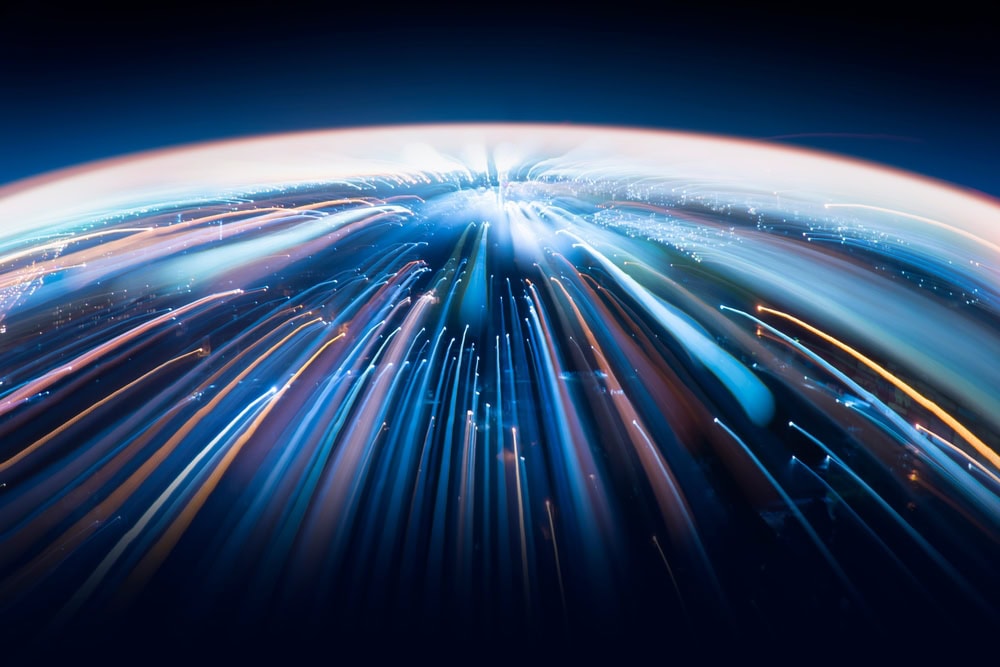 High-speed light trails representing global connectivity and advanced technology networks.