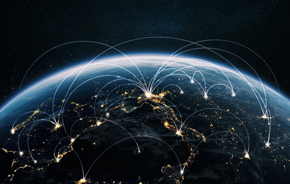 Global interconnected network of communication and data exchange at night.