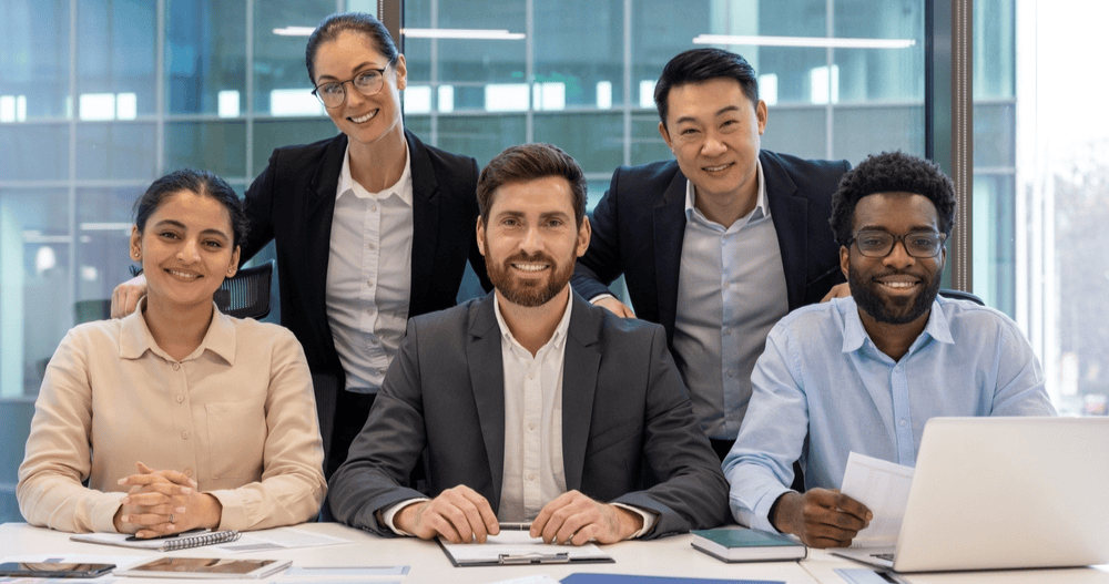 Diverse professional team collaborating in a modern office setting.